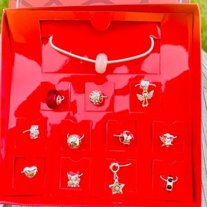 Avon Charm Bracelet with 12 Charms NWT Adjustable length bracelet